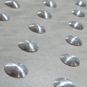 Tactile stainless steel overlay studs without adhesive