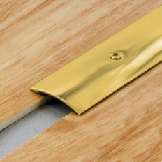 Tapajunta de latón sobrepuesto taladrado